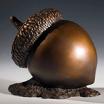 The Seed, a bronze sculpture by Carol Alleman featuring the acorn