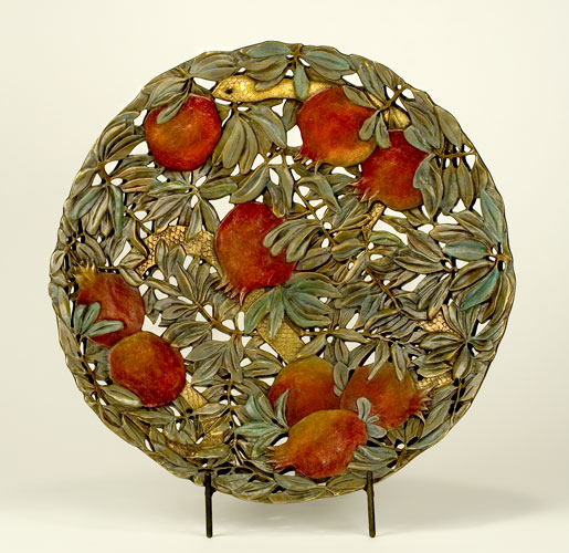 Seeds of Harmony bronze bowl by Carol Alleman, displayed on easel