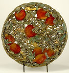 Seeds of Harmony, a bronze bowl by Carol Alleman featuring a snake and pomegrantes